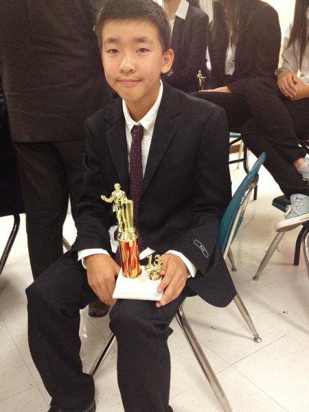 Here Vincent sits, proudly displaying a well earned trophy.